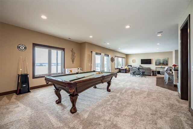 rec room with pool table and light colored carpet