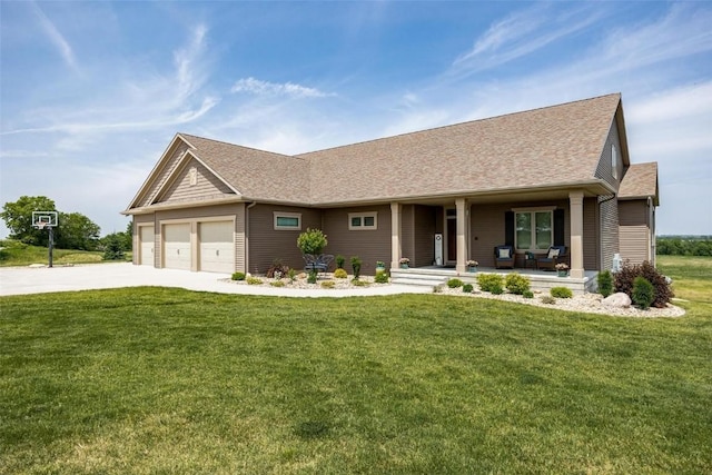 view of front of house featuring a garage, covered porch, and a front lawn