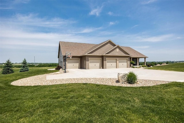 view of front of property with a garage and a front yard