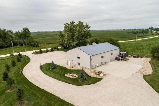 birds eye view of property with a rural view