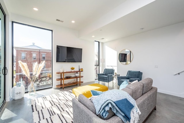 living room featuring concrete floors