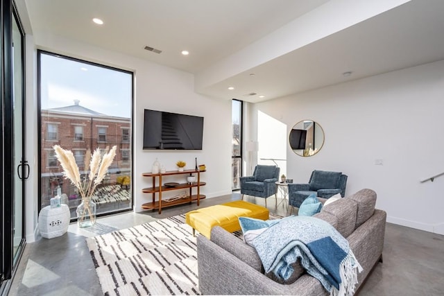 living room with concrete flooring