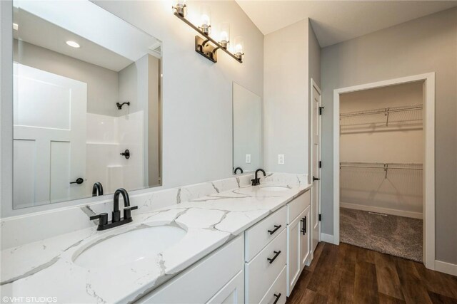 bathroom featuring vanity and hardwood / wood-style flooring