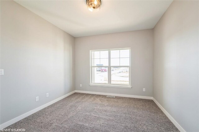 empty room with carpet flooring