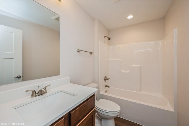 full bathroom with vanity, bathtub / shower combination, and toilet