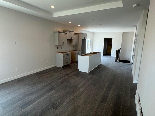 2362 Bluegrass St, Marion, IA 52302 - kitchen featuring recessed lighting, dark wood finished floors, baseboards, a kitchen island, and gray cabinetry