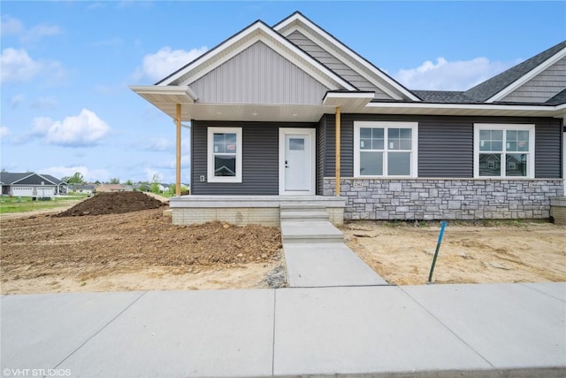 2362 Bluegrass St, Marion, IA 52302 - view of front of home featuring stone siding and covered porch