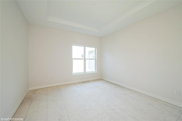 2362 Bluegrass St, Marion, IA 52302 - unfurnished room featuring baseboards and a tray ceiling