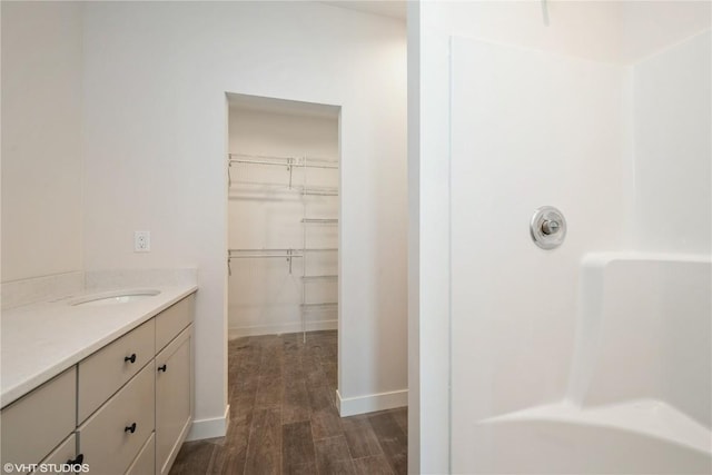 2362 Bluegrass St, Marion, IA 52302 - full bath with wood finished floors, vanity, a spacious closet, and a shower