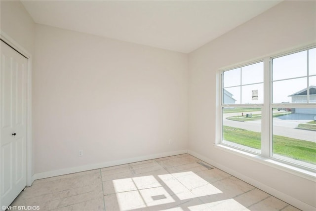 2362 Bluegrass St, Marion, IA 52302 - unfurnished bedroom featuring baseboards and a closet