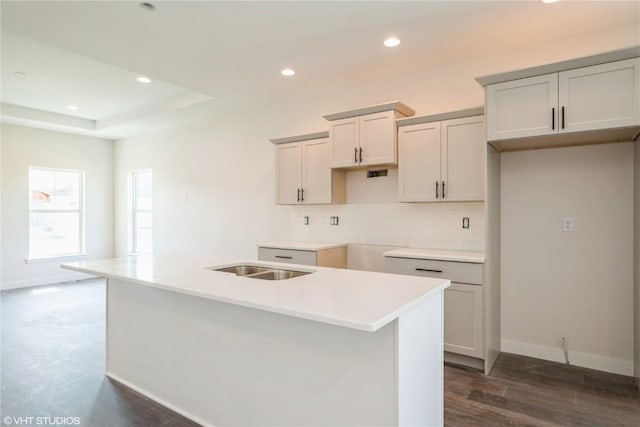 2362 Bluegrass St, Marion, IA 52302 - kitchen with backsplash, a center island with sink, recessed lighting, gray cabinets, and a tray ceiling