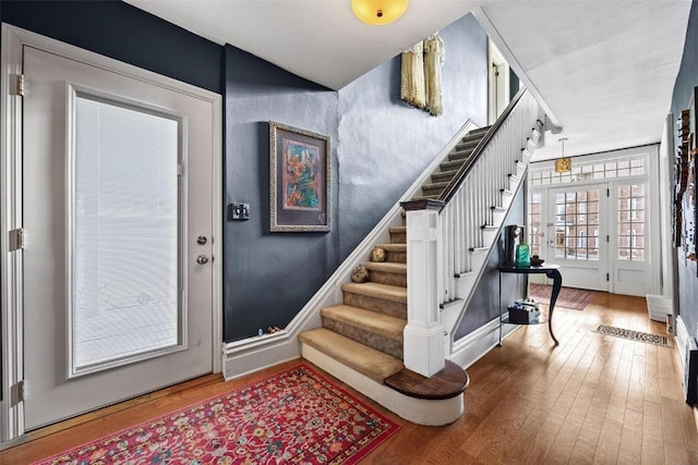 foyer entrance featuring hardwood / wood-style floors