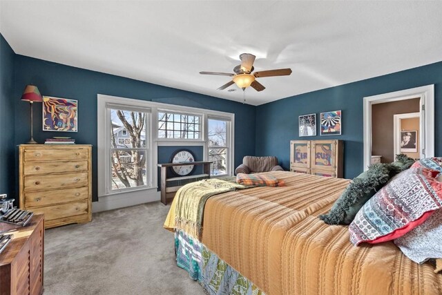 bedroom with ceiling fan and carpet floors