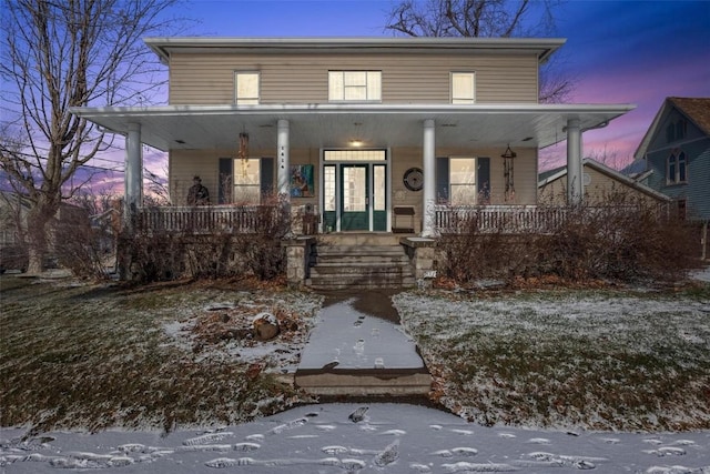 view of front of property featuring covered porch