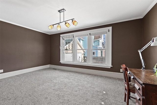 unfurnished dining area featuring carpet and crown molding