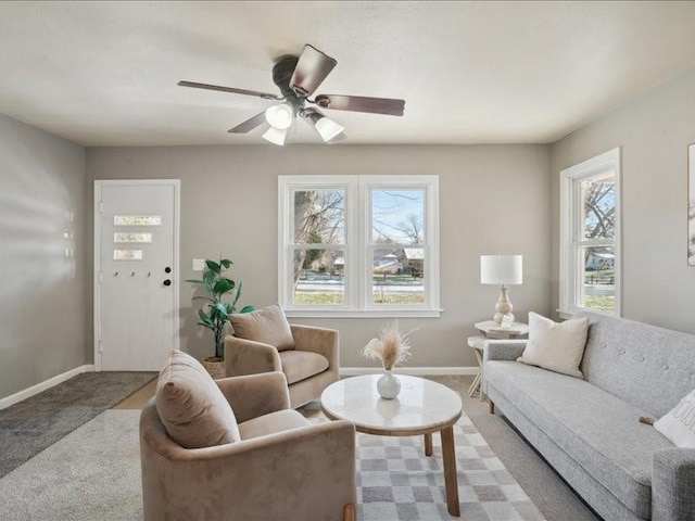 carpeted living room featuring ceiling fan