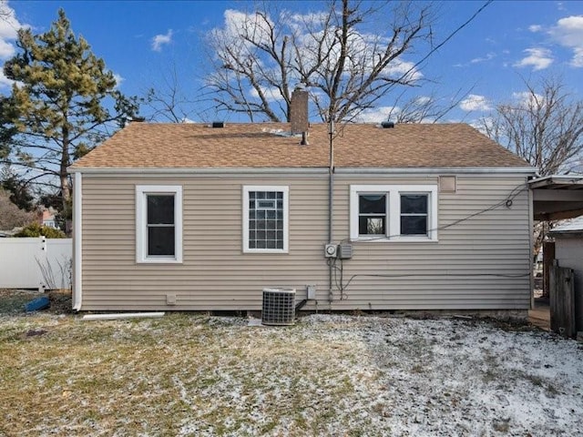 rear view of property featuring central AC unit