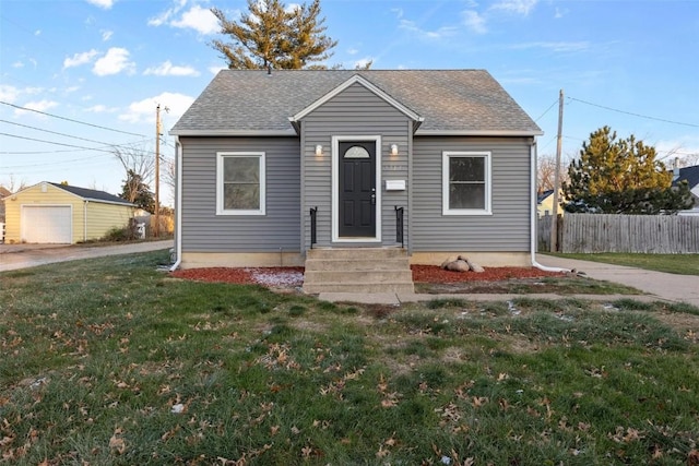 bungalow-style home featuring a front yard