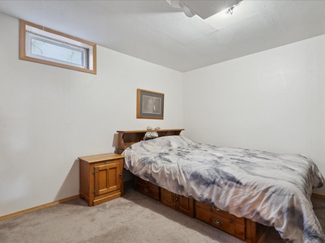 bedroom featuring light carpet