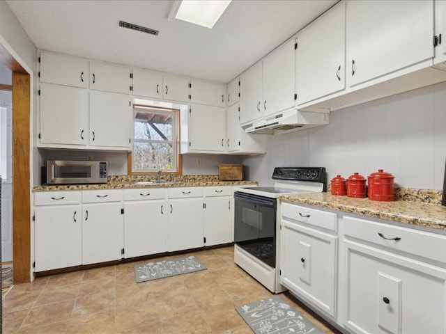 kitchen featuring white cabinetry, electric stove, and sink