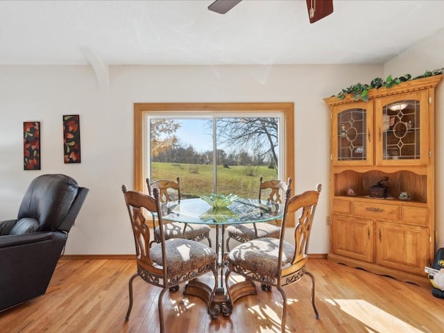 dining area featuring ceiling fan and light hardwood / wood-style flooring