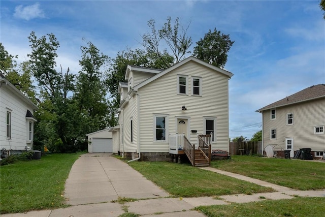 front of property featuring an outdoor structure, a front yard, and a garage