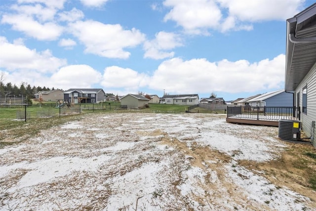 view of yard featuring central AC and a wooden deck