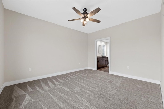 unfurnished bedroom with connected bathroom, ceiling fan, and carpet floors