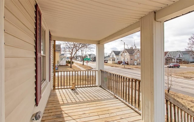 wooden terrace with a porch