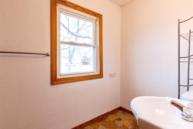 bathroom featuring sink and a healthy amount of sunlight