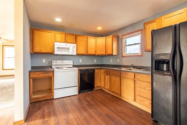 kitchen featuring sink, ceiling fan, black appliances, and dark wood-type flooring