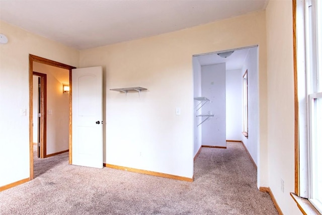 unfurnished bedroom with light carpet