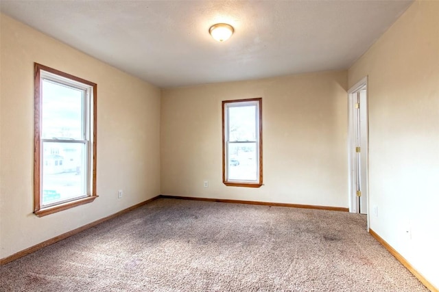 spare room featuring carpet flooring