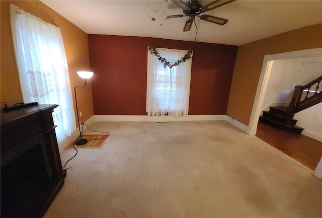 interior space featuring a fireplace and ceiling fan