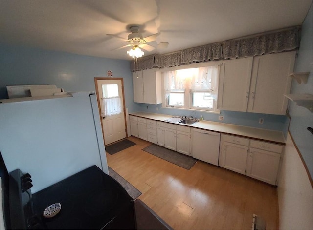 kitchen featuring sink, white appliances, light hardwood / wood-style flooring, ceiling fan, and white cabinetry