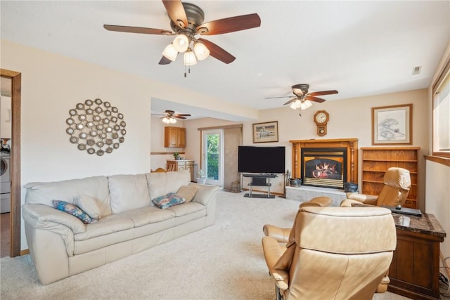 living room featuring carpet floors and washer / clothes dryer