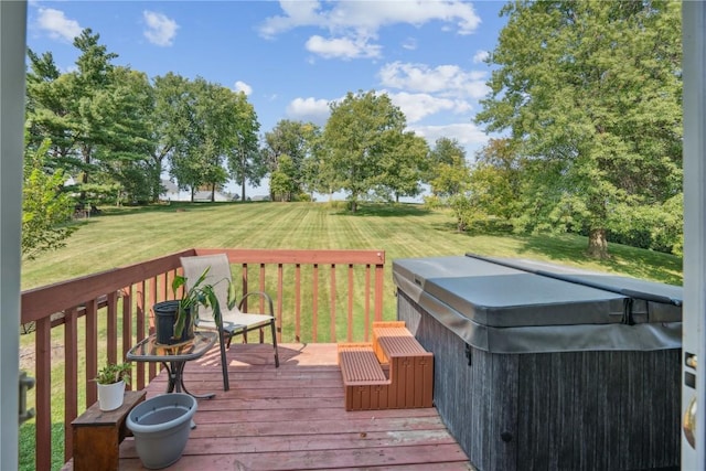 deck featuring a yard and a hot tub