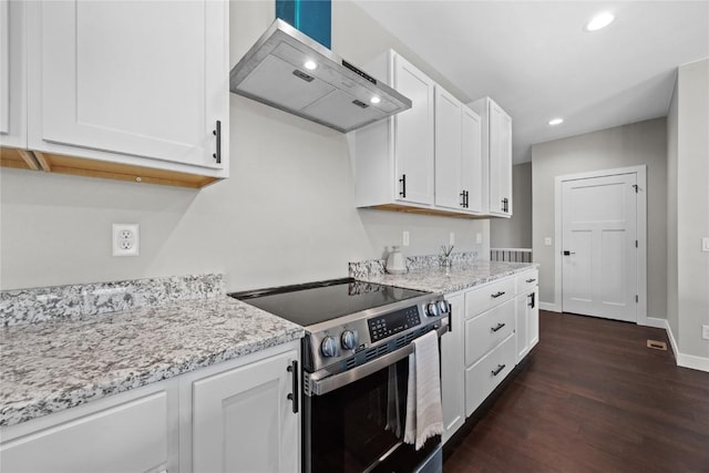 1596 Connection Ave, Marion, IA 52302 - kitchen with electric range, wall chimney exhaust hood, dark wood-style flooring, white cabinets, and recessed lighting