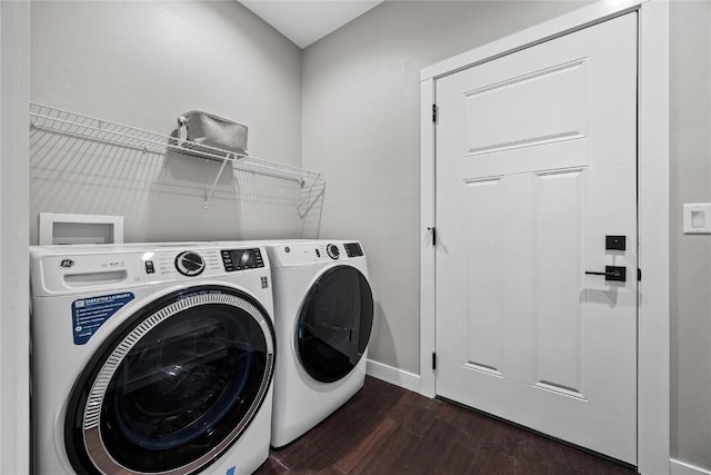 1596 Connection Ave, Marion, IA 52302 - laundry room featuring washer and clothes dryer, dark wood-style flooring, and baseboards