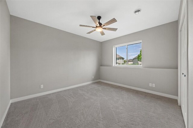 1596 Connection Ave, Marion, IA 52302 - carpeted empty room featuring a ceiling fan, baseboards, and vaulted ceiling