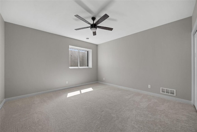 1596 Connection Ave, Marion, IA 52302 - spare room featuring carpet, a ceiling fan, and baseboards