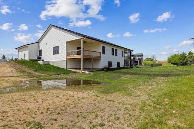 1596 Connection Ave, Marion, IA 52302 - rear view of property featuring a ceiling fan and a yard