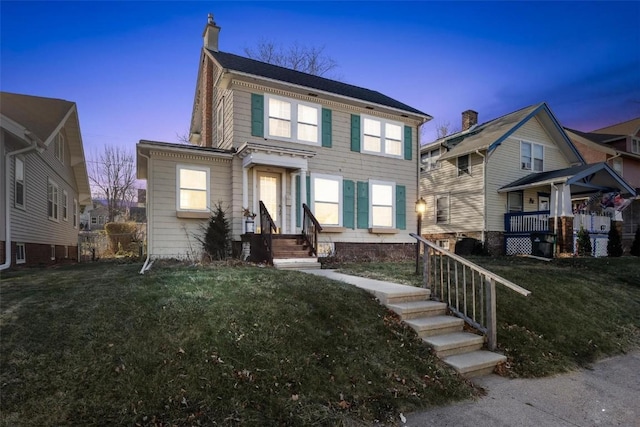 view of front of house featuring a yard