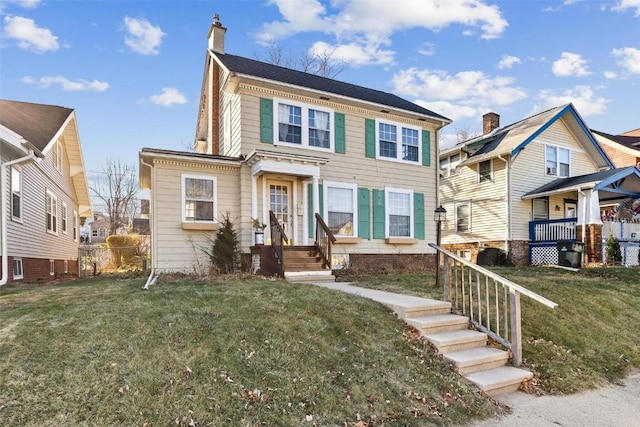 view of front of home with a front yard