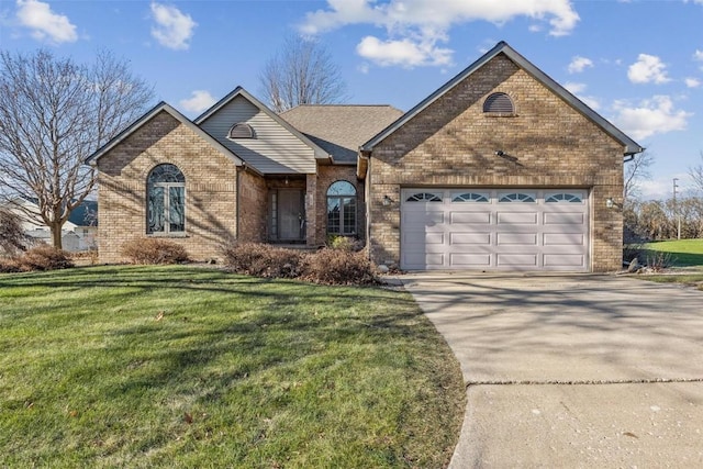 view of front of house featuring a garage and a front lawn