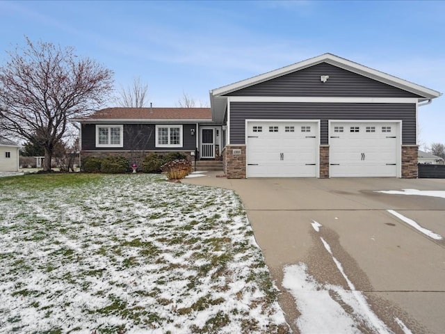 view of front facade with a garage and a lawn