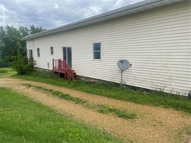 back of house featuring a lawn