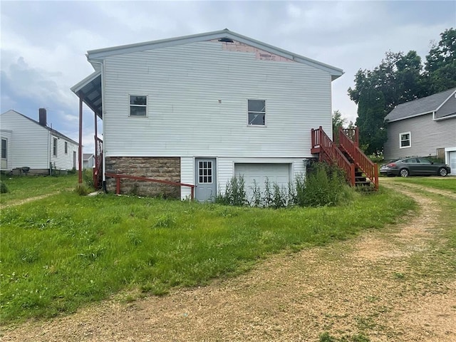 view of side of home with a garage