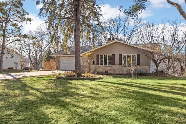 single story home with concrete driveway, stone siding, a front lawn, and an attached garage