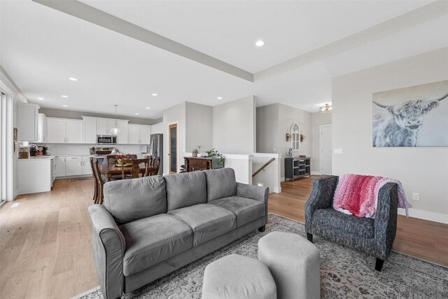 living room with light hardwood / wood-style flooring